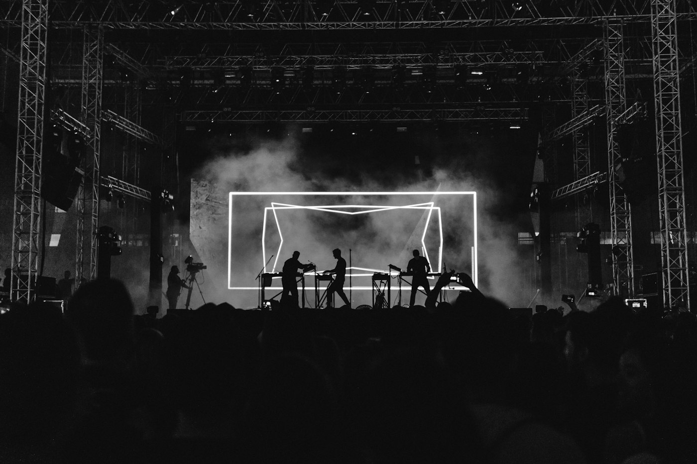 Metal concert crowd with raised hands